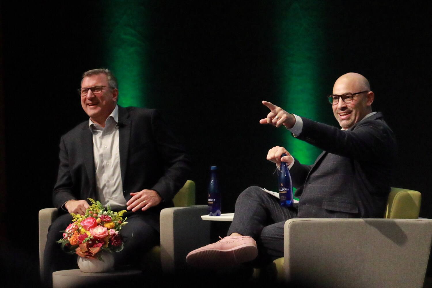 Speakers laughing together on stage at OverdriveAI 2025